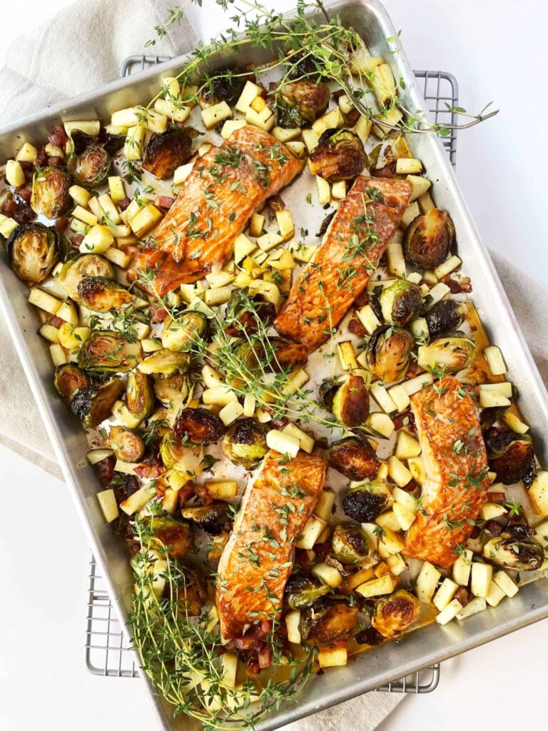 sheet pan dinner with salmon, brussels sprouts, pancetta, granny smith apples with apple cider reduction